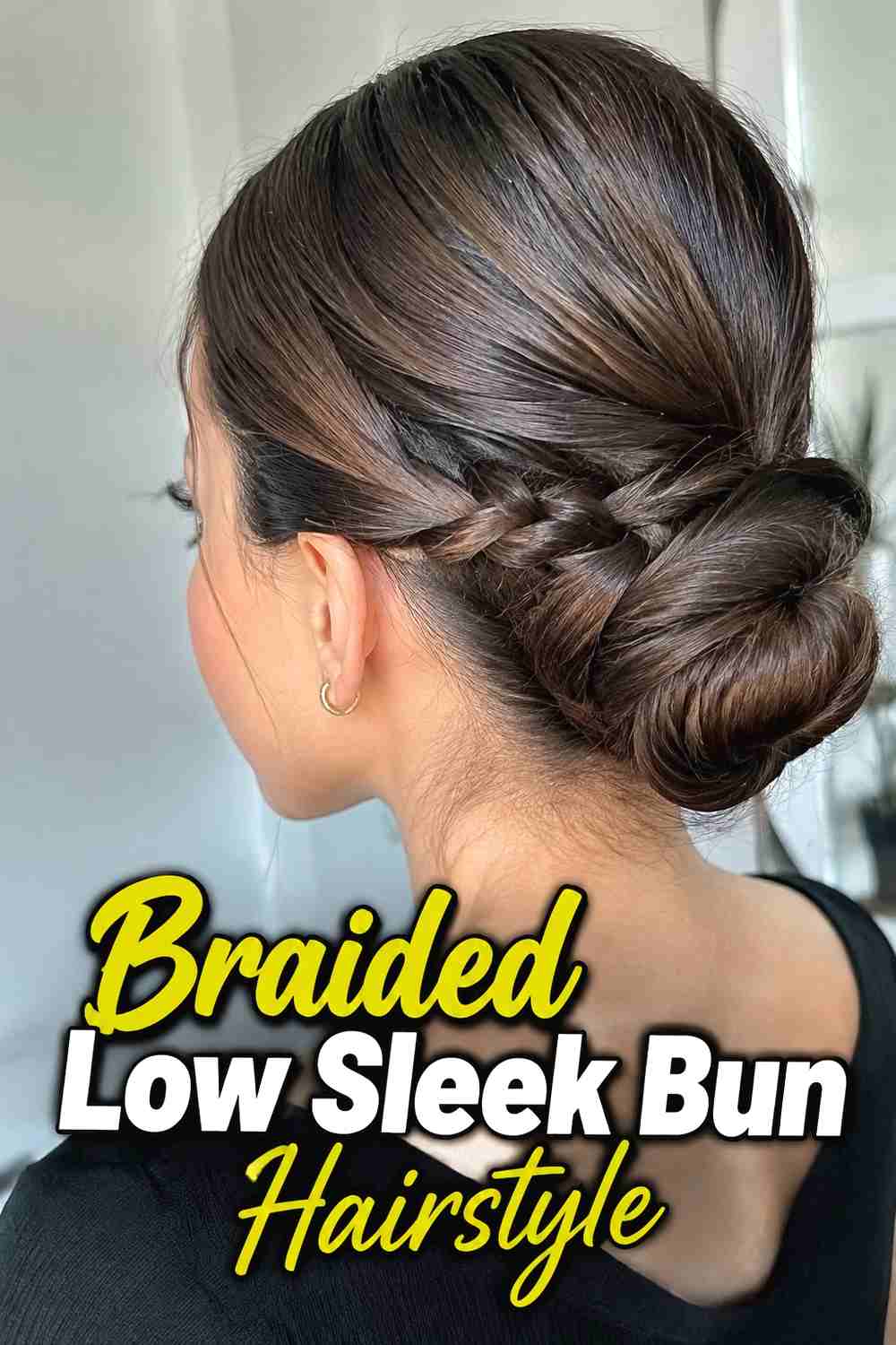 3. Braided Low Sleek Bun Hairstyle