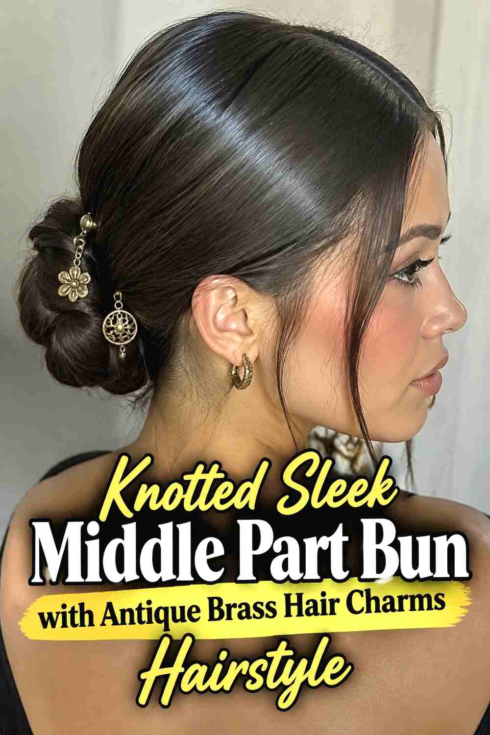 9. Knotted Sleek Middle Part Bun With Antique Brass Hair Charms Hairstyle