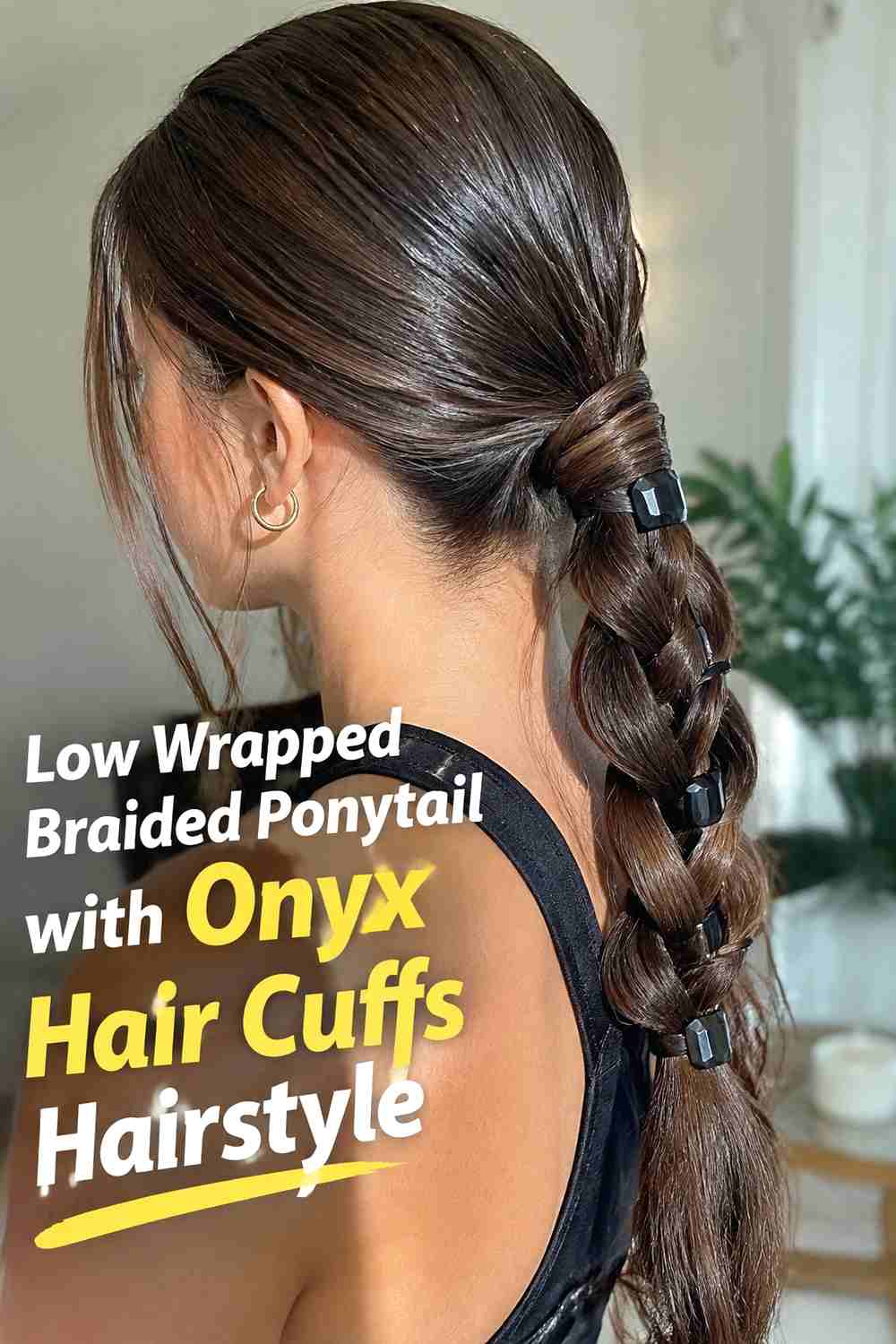 2. Low Wrapped Braided Ponytail With Onyx Hair Cuffs Hairstyle