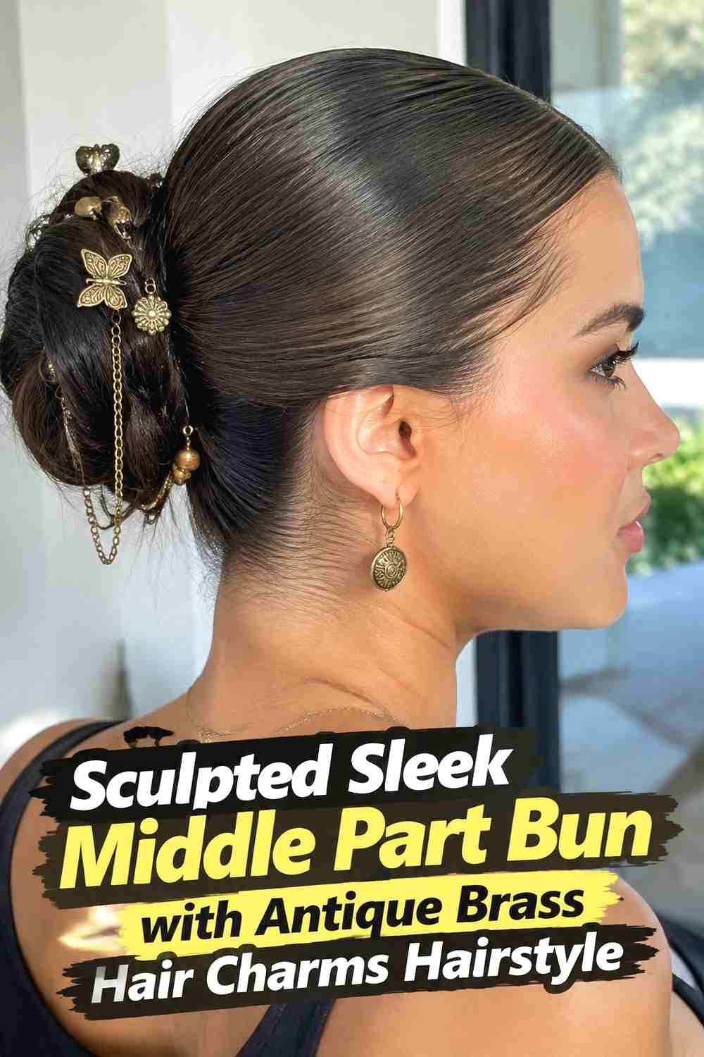 14. Sculpted Sleek Middle Part Bun With Antique Brass Hair Charms Hairstyle