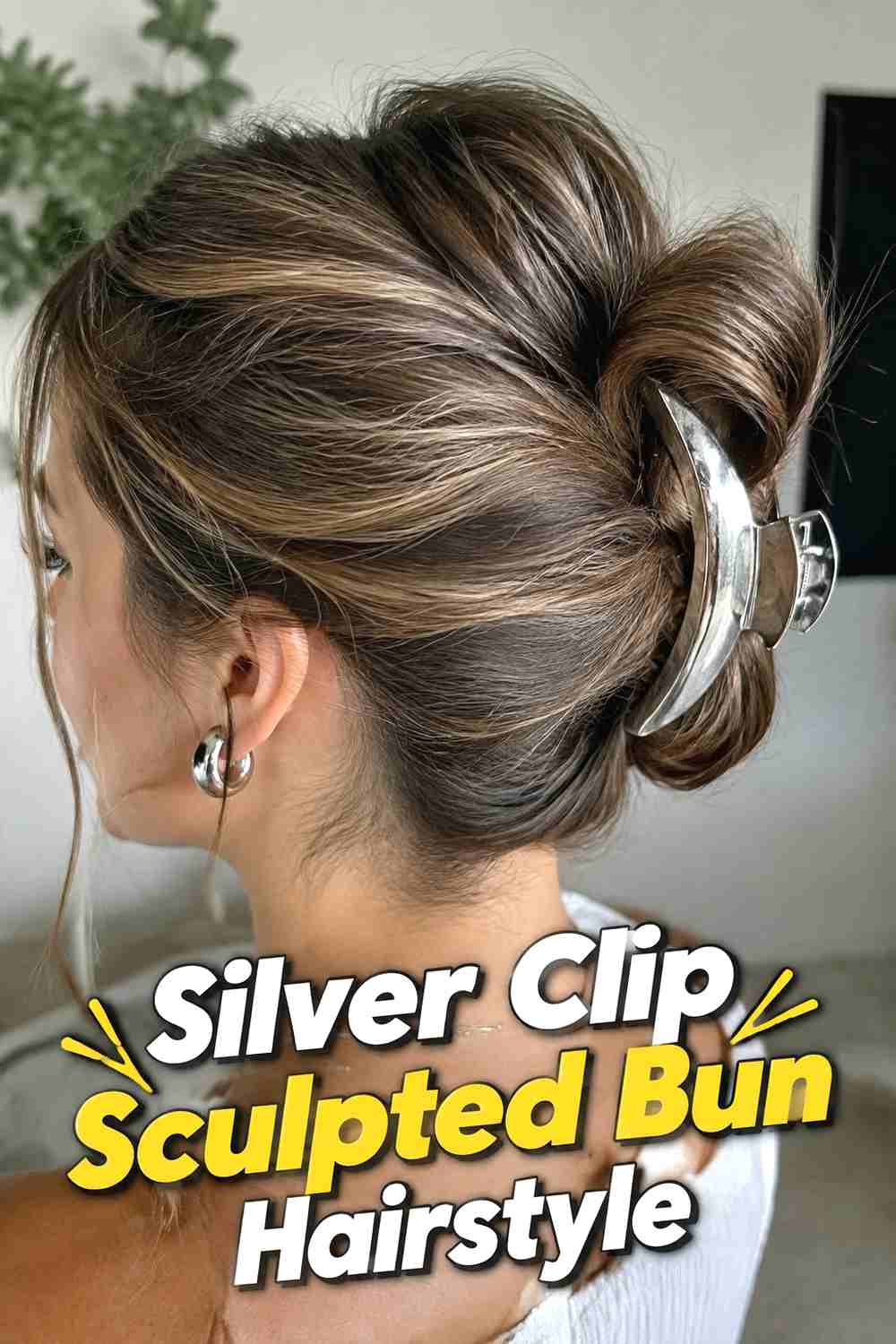 7. Silver Clip Sculpted Bun Hairstyle