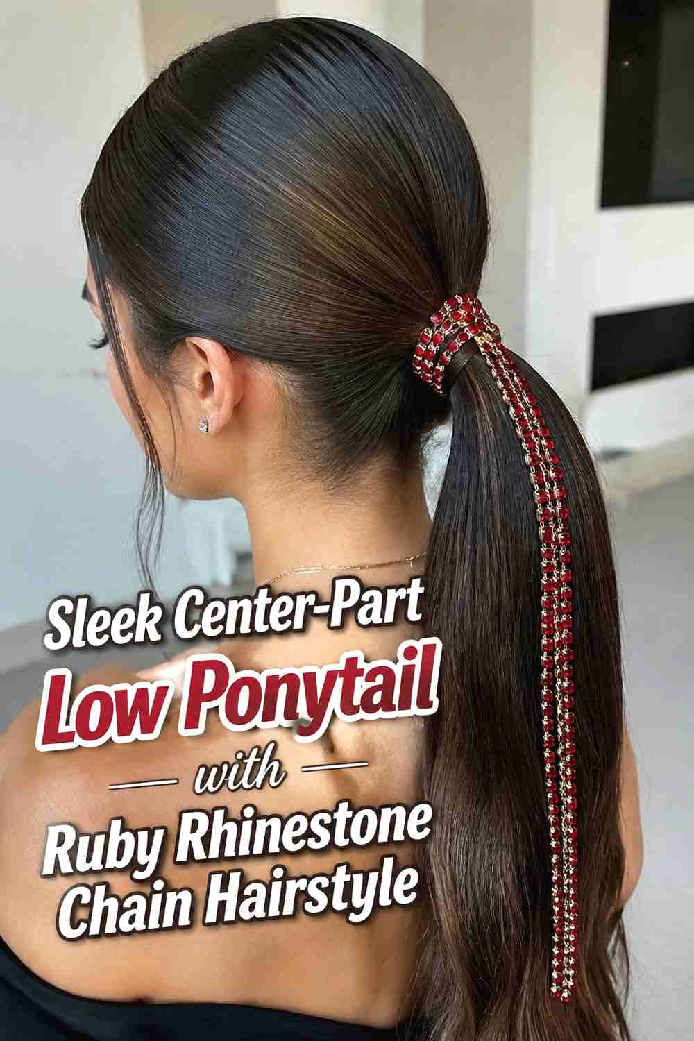 1. Sleek Center Part Low Ponytail With Ruby Rhinestone Chain Hairstyle