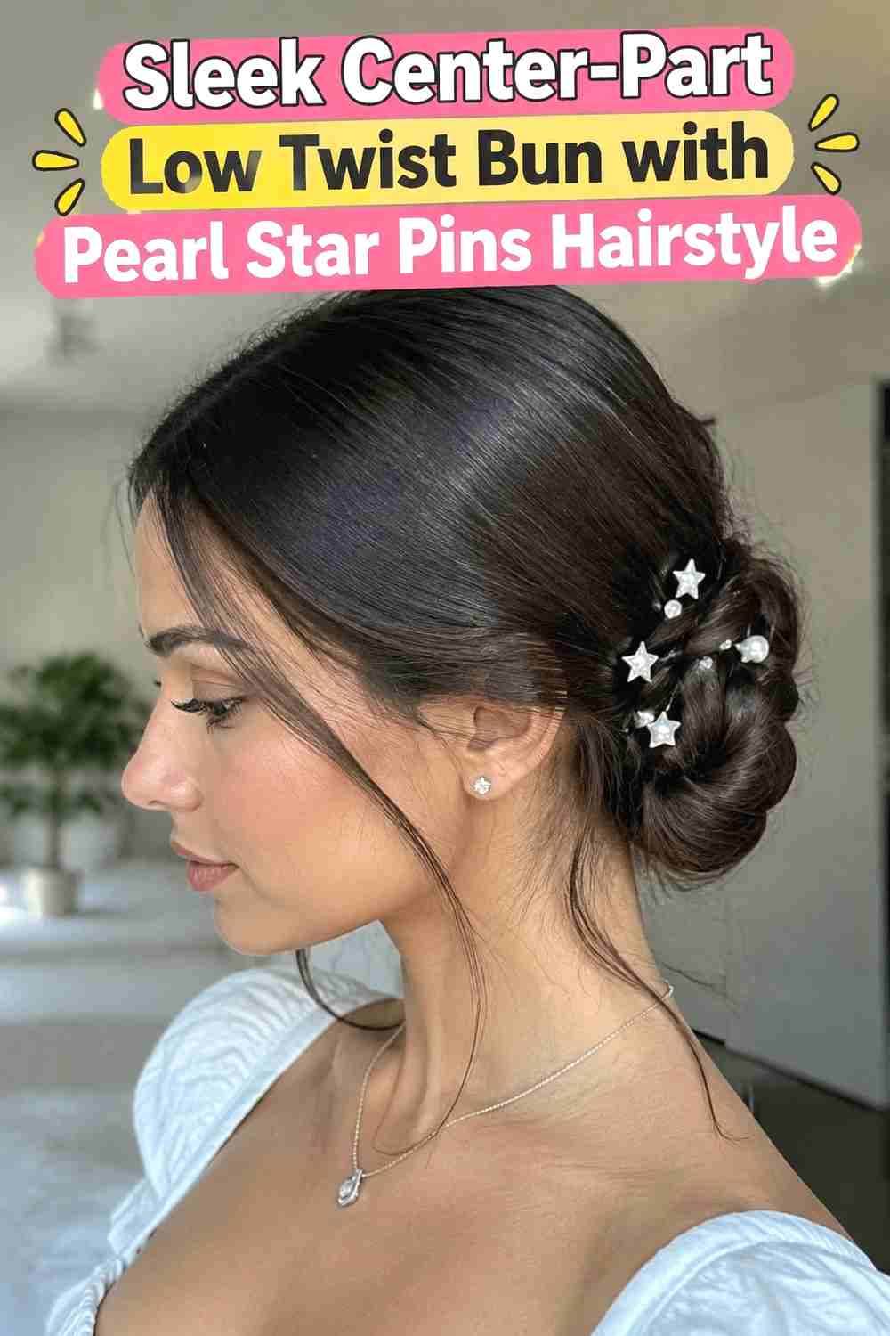 2. Sleek Center Part Low Twist Bun With Pearl Star Pins Hairstyle