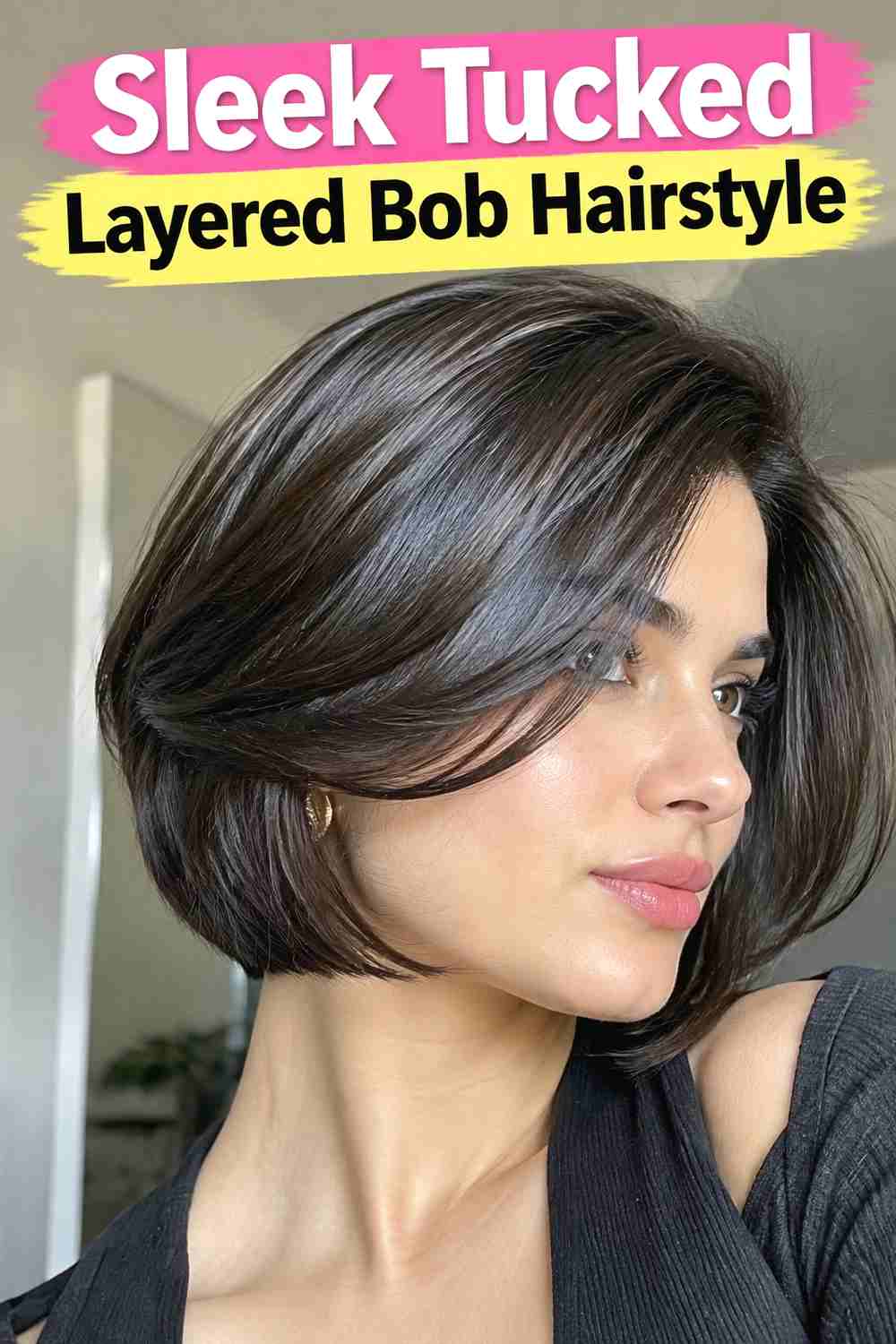 9. Sleek Tucked Layered Bob Hairstyle