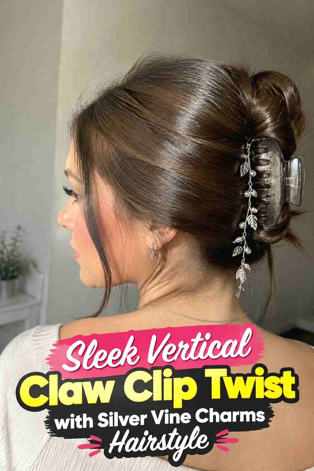 6. Sleek Vertical Claw Clip Twist With Silver Vine Charms Hairstyle