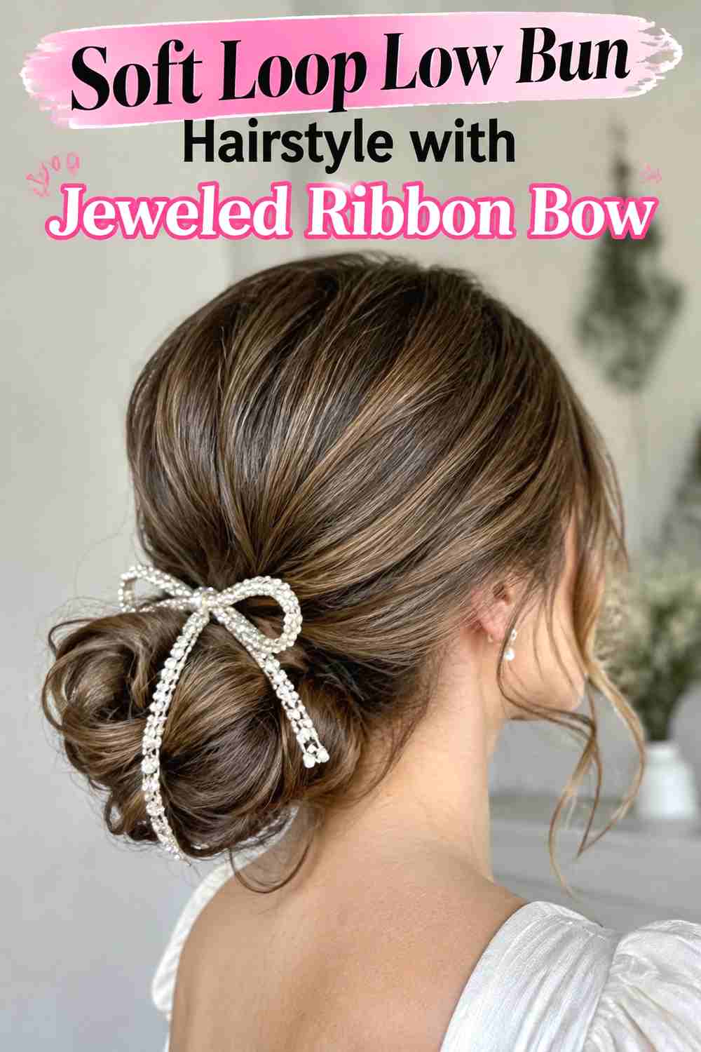 8. Soft Loop Low Bun Hairstyle With Jeweled Ribbon Bow
