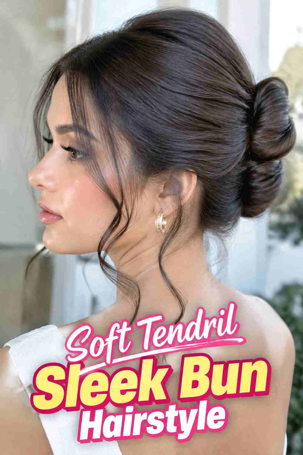 16. Soft Tendril Sleek Bun Hairstyle
