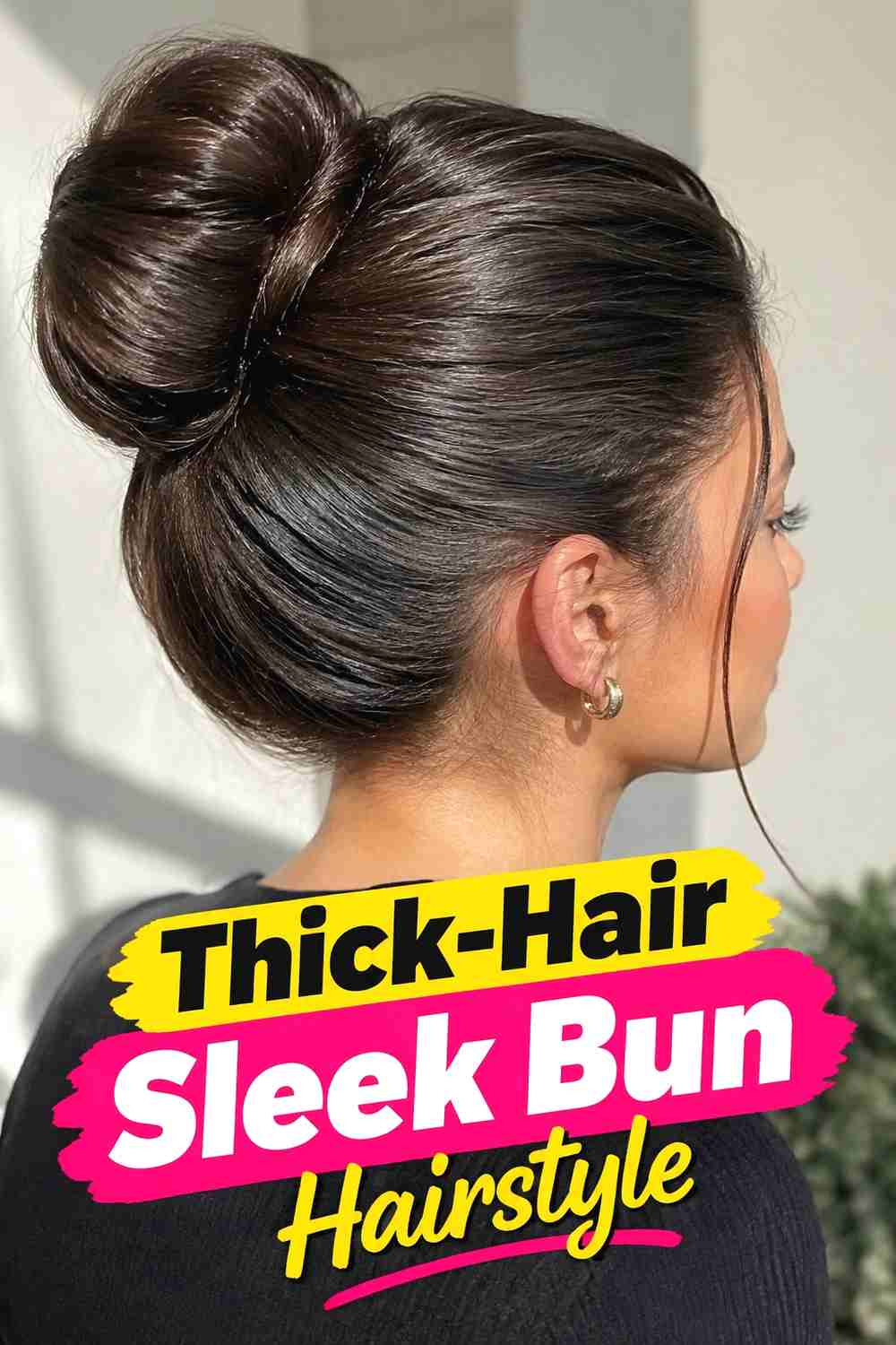 13. Thick Hair Sleek Bun Hairstyle