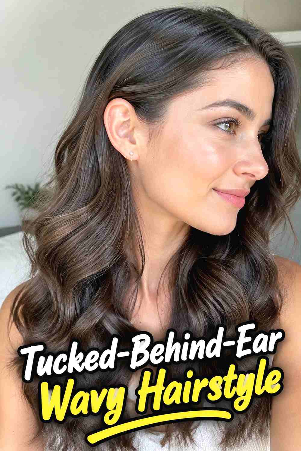 3. Tucked Behind Ear Wavy Hairstyle