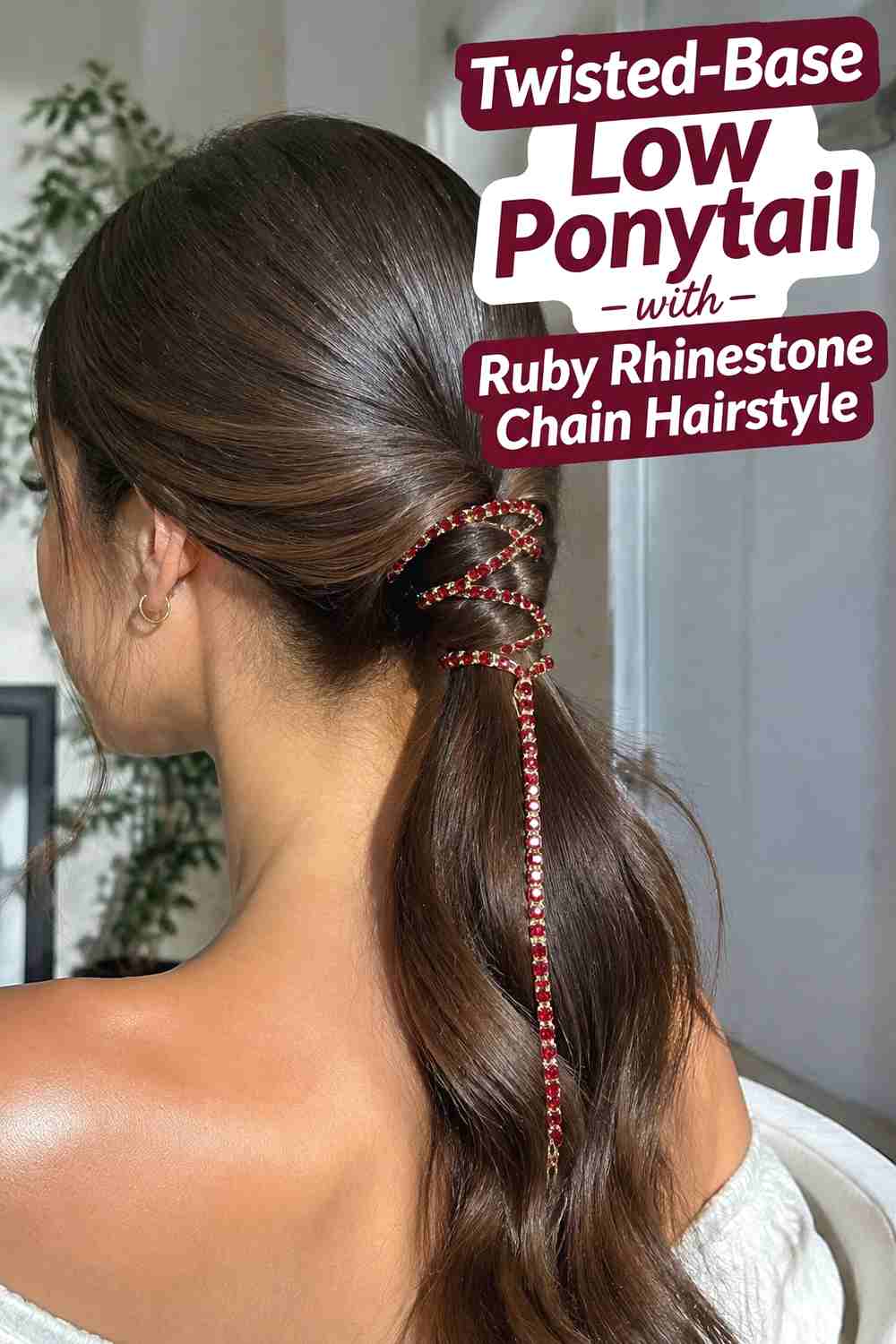 5. Twisted Base Low Ponytail With Ruby Rhinestone Chain Hairstyle