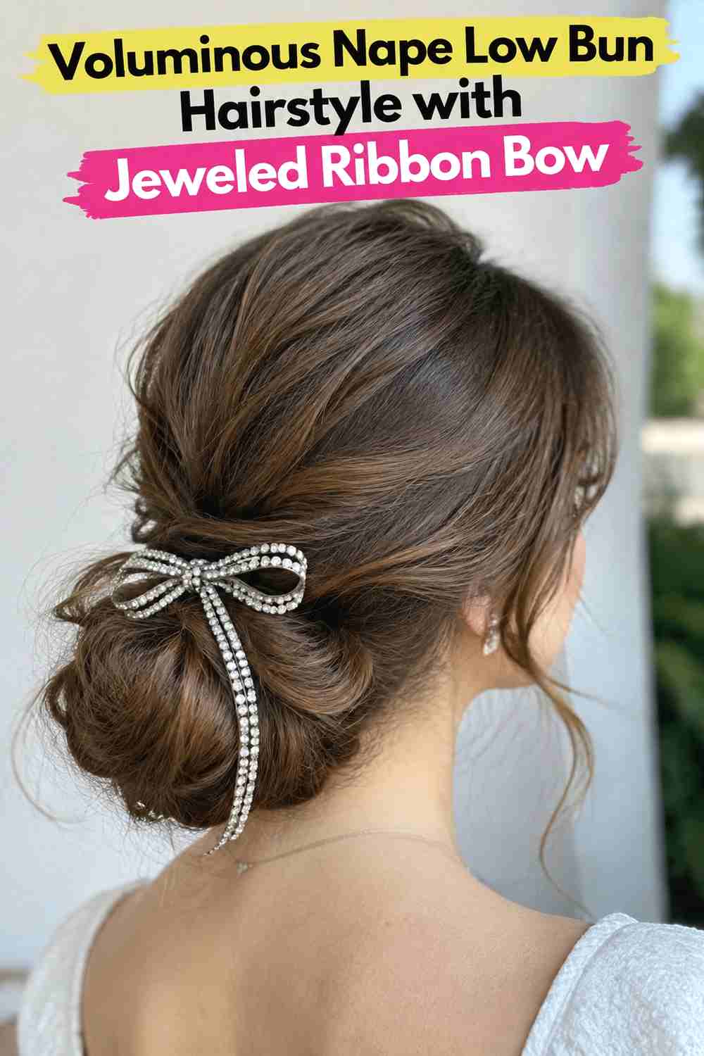 11. Voluminous Nape Low Bun Hairstyle With Jeweled Ribbon Bow