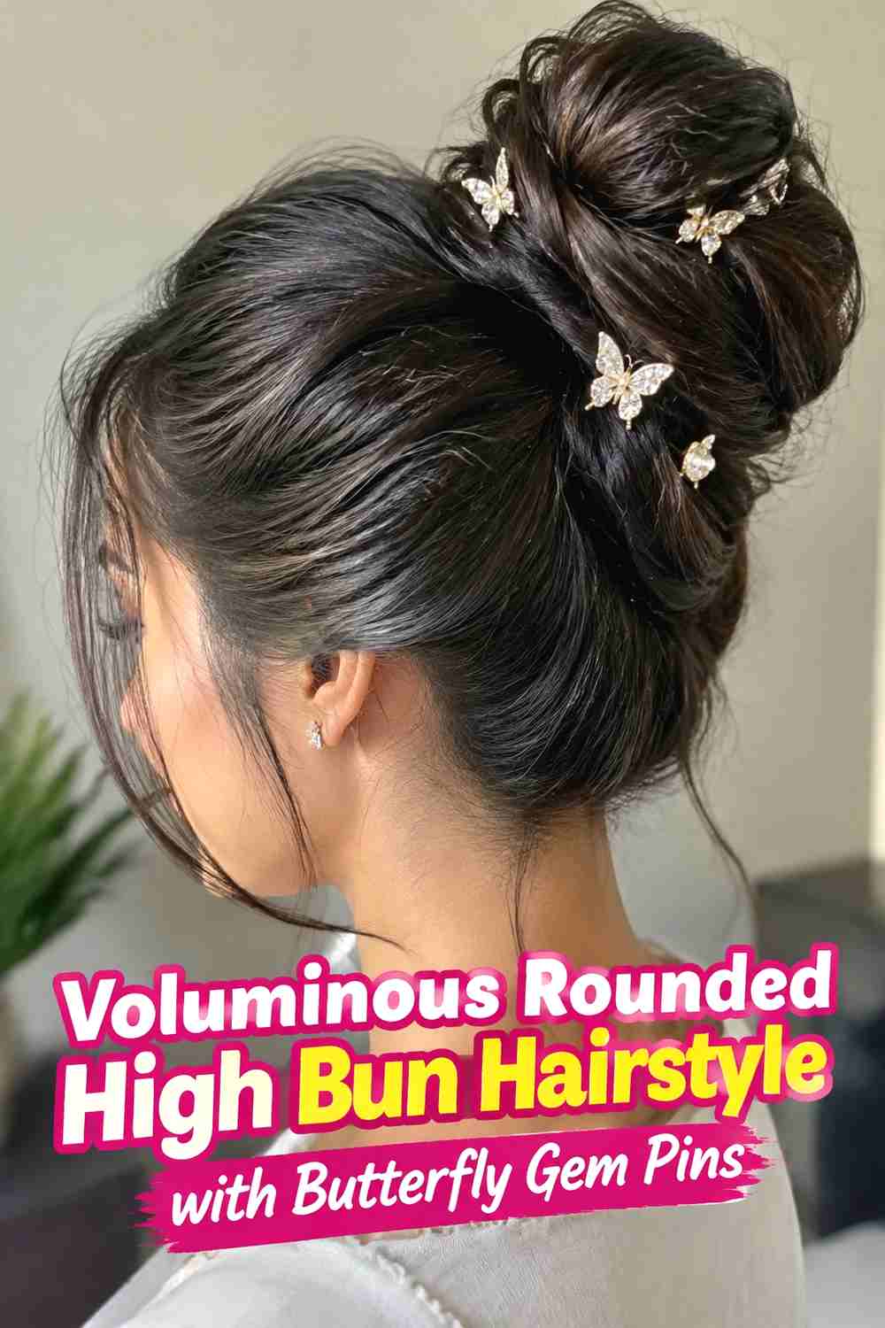 8. Voluminous Rounded High Bun Hairstyle With Butterfly Gem Pins